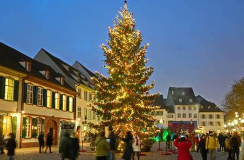 Christmas Markets river cruise ship sailing past illuminated European towns at dusk